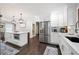 Well-appointed kitchen with island, stainless steel refrigerator, and stylish lighting at 3600 Morishop Nw Cv, Marietta, GA 30064