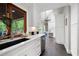 Bright kitchen featuring white cabinetry, quartz countertops, and stainless steel appliances at 3600 Morishop Nw Cv, Marietta, GA 30064