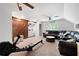 Spacious living room with barn door, plush seating, neutral carpet, and natural light at 3600 Morishop Nw Cv, Marietta, GA 30064