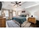 Comfortable bedroom with tray ceilings, shiplap accent wall, and lots of natural light at 3600 Morishop Nw Cv, Marietta, GA 30064