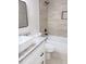 Updated bathroom featuring a modern sink, granite countertop, and tub/shower with stylish tile at 4411 Flakes Mill Rd, Ellenwood, GA 30294