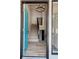 Bright foyer with stylish chandelier, stairs to the second level, and a vibrant blue front door at 4411 Flakes Mill Rd, Ellenwood, GA 30294