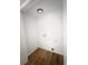 A compact laundry room with hardwood floors ready for appliances at 4411 Flakes Mill Rd, Ellenwood, GA 30294