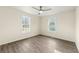 Inviting bedroom with sleek floors, neutral walls, a ceiling fan and windows for natural light at 2331 Luther St, Lithonia, GA 30058
