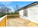 Expansive wood deck featuring natural wood railings and bright white house siding for outdoor living at 2331 Luther St, Lithonia, GA 30058