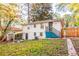 Back of home featuring steps up to the main floor entrance, patio and fenced in yard at 3182 Latona Sw Dr, Atlanta, GA 30354