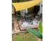 Backyard with a wooden patio, shade sail, and outdoor seating at 3182 Latona Sw Dr, Atlanta, GA 30354