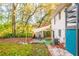 Spacious backyard featuring a patio area with outdoor furniture, a sunshade, and a large grassy area at 3182 Latona Sw Dr, Atlanta, GA 30354