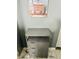 Bathroom with gray storage and decorative wall art showcasing a vanity at 3182 Latona Sw Dr, Atlanta, GA 30354