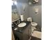 The bathroom features a modern sink vanity with a black countertop, and decor at 3182 Latona Sw Dr, Atlanta, GA 30354