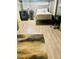 Bedroom with laminate floors, laundry, bed and desk, and neutral decor at 3182 Latona Sw Dr, Atlanta, GA 30354