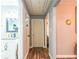 Hallway featuring access to the bathroom and bedroom with laminate wood flooring at 3182 Latona Sw Dr, Atlanta, GA 30354