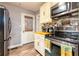 Kitchen area with stainless steel appliances, wood countertops, backsplash and white cabinets at 3182 Latona Sw Dr, Atlanta, GA 30354