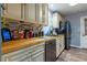 Kitchen with wooden countertops, stainless steel appliances, and light wood cabinetry at 3182 Latona Sw Dr, Atlanta, GA 30354