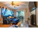 Cozy living room showcasing stylish blue curtains, hardwood floors, and views into a dining area at 3182 Latona Sw Dr, Atlanta, GA 30354