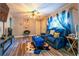 Inviting living room featuring hardwood floors, blue sofas, a fireplace and a window at 3182 Latona Sw Dr, Atlanta, GA 30354