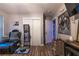 View of a living room with hardwood floors, and closet doors, with a leather couch and a console at 3182 Latona Sw Dr, Atlanta, GA 30354