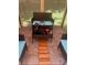 Patio seating area with a wooden walkway, chairs, and floral rug at 3182 Latona Sw Dr, Atlanta, GA 30354