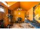 Vibrant orange shed interior featuring a desk, massage table, and unique decor, perfect for a studio or office at 3182 Latona Sw Dr, Atlanta, GA 30354