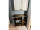 Kitchen storage rack with open shelving, great for organization at 3182 Latona Sw Dr, Atlanta, GA 30354