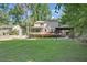 Expansive backyard with a deck, pergola, and lush green lawn at 4378 Heritage Glen Ct, Marietta, GA 30068