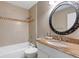 Cozy bathroom with a neutral color scheme, featuring a tub with tiled walls and granite topped vanity at 4378 Heritage Glen Ct, Marietta, GA 30068