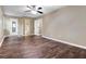 This large bedroom has attractive wood-look flooring, three doors, and a ceiling fan at 4378 Heritage Glen Ct, Marietta, GA 30068