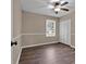 This bedroom features chair rail trim, a ceiling fan, and wood-look floors at 4378 Heritage Glen Ct, Marietta, GA 30068