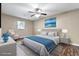 A staged bedroom has a comfy bed, stylish decor, and wood-look flooring at 4378 Heritage Glen Ct, Marietta, GA 30068