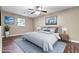 A staged bedroom has a comfy bed, stylish decor, and wood-look flooring at 4378 Heritage Glen Ct, Marietta, GA 30068