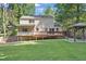 Rear exterior view featuring the deck, sunroom, pergola and yard at 4378 Heritage Glen Ct, Marietta, GA 30068