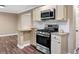 Open kitchen with stainless steel appliances, granite countertops, and stylish subway tile backsplash at 4378 Heritage Glen Ct, Marietta, GA 30068