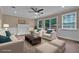 Virtually staged living room featuring a fireplace, neutral furniture, and bright natural light at 4378 Heritage Glen Ct, Marietta, GA 30068