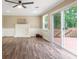 Living room featuring a white decorative fireplace and sliding glass doors to the deck at 4378 Heritage Glen Ct, Marietta, GA 30068