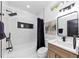 Bright bathroom featuring a modern vanity, stylish mirror, and black hardware at 445 Westmeath Sw Dr, Atlanta, GA 30310