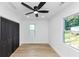 Bedroom featuring wood floors, closet, a window and neutral walls at 445 Westmeath Sw Dr, Atlanta, GA 30310