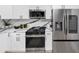Bright kitchen featuring stainless steel appliances, a gas range, and white and gray marble countertops at 445 Westmeath Sw Dr, Atlanta, GA 30310