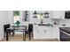 Charming kitchen features white cabinets, a modern faucet, and stainless steel sink at 445 Westmeath Sw Dr, Atlanta, GA 30310