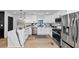Modern kitchen with stainless appliances, granite countertops, an island, and ample cabinet space at 445 Westmeath Sw Dr, Atlanta, GA 30310