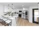 Modern kitchen featuring stainless appliances, sleek countertops, an island, and ample cabinet space at 445 Westmeath Sw Dr, Atlanta, GA 30310