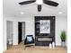 Stylish sitting area featuring a marble fireplace, modern decor, and sleek black accents at 445 Westmeath Sw Dr, Atlanta, GA 30310