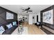 Spacious living area with modern accents, stylish furniture, and an open flow to the kitchen at 445 Westmeath Sw Dr, Atlanta, GA 30310