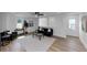 Inviting living room with neutral tones, hardwood floors, and ample sunlight at 445 Westmeath Sw Dr, Atlanta, GA 30310