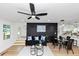 Open-concept living area featuring modern decor, sleek black accents, and hardwood floors at 445 Westmeath Sw Dr, Atlanta, GA 30310