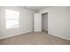Bright bedroom with carpet, walk-in closet, and bright natural light at 4932 Jatoba Rd, Acworth, GA 30101