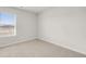Bright, carpeted bedroom features a large window letting in natural light at 4932 Jatoba Rd, Acworth, GA 30101
