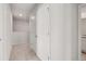 Upstairs hallway with neutral carpet and modern doors, offering privacy and style at 4932 Jatoba Rd, Acworth, GA 30101