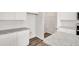 Modern kitchen features granite countertops, white cabinetry and a convenient pantry at 4932 Jatoba Rd, Acworth, GA 30101