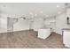 Open-concept living area with modern kitchen, and stylish flooring, ideal for entertaining at 4932 Jatoba Rd, Acworth, GA 30101