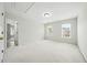 Bright bedroom with plush carpeting and natural light from two windows at 12554 Huntington Trce, Alpharetta, GA 30005